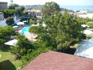 an overhead view of a resort with a pool and trees at Hotel Savoia in Procida