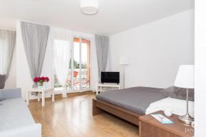 Posteľ alebo postele v izbe v ubytovaní Jantar Apartamenty- Zielone Tarasy
