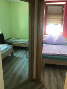 Postel nebo postele na pokoji v ubytování Ferienwohnung Zeitler
