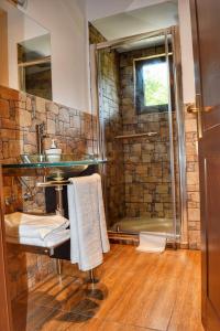 a bathroom with a sink and a shower at Heaven Guesthouse in Corbeni +186 photos