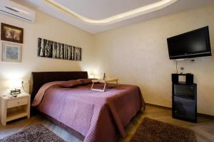 Ein Bett oder Betten in einem Zimmer der Unterkunft Enjoy Belgrade