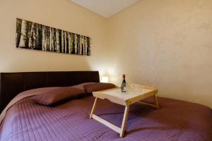 Ein Bett oder Betten in einem Zimmer der Unterkunft Enjoy Belgrade