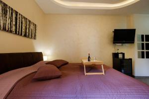 Ein Bett oder Betten in einem Zimmer der Unterkunft Enjoy Belgrade