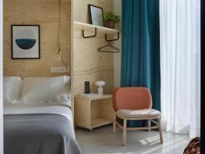 Talo Urban Rooms客房内的一张或多张床位