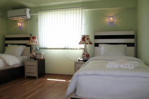 Voodi või voodid majutusasutuse Hotel For You toas