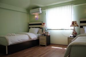 Voodi või voodid majutusasutuse Hotel For You toas