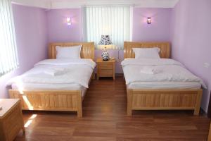 Voodi või voodid majutusasutuse Hotel For You toas