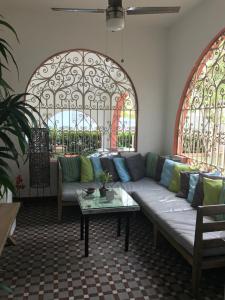 a living room filled with furniture and a window at Casa Isabel B&B in San Juan