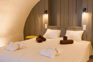 Ένα ή περισσότερα κρεβάτια σε δωμάτιο στο Johan Suites & Spa
