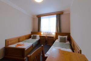 Posteľ alebo postele v izbe v ubytovaní Hotel Soudek