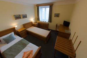 Posteľ alebo postele v izbe v ubytovaní Hotel Soudek