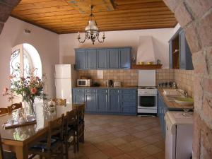 A kitchen or kitchenette at Traditional Stone Villa Olympia