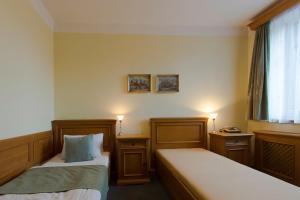 Posteľ alebo postele v izbe v ubytovaní Hotel Soudek