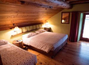 Tempat tidur dalam kamar di Albergo Montagna Di Luce