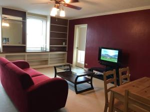 a living room with a couch and a tv at Downtown Condo with a View Sleeps 4 5D in Atlanta