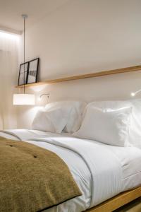 Säng eller sängar i ett rum på Lagos Avenida Hotel