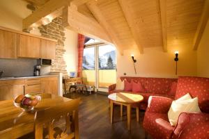 a living room with a couch and a table at Bergidyll in Oberstdorf