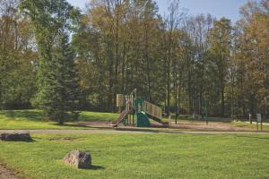 a playground with a slide in a park at Club Wyndham Shawnee Village in East Stroudsburg