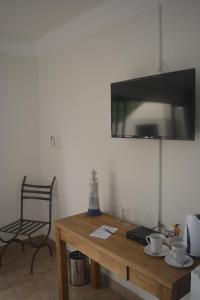 TV a/nebo společenská místnost v ubytování Beach Retreat Guesthouse