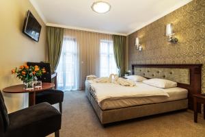 Łóżko lub łóżka w pokoju w obiekcie Pałac Margot Nature&SPA