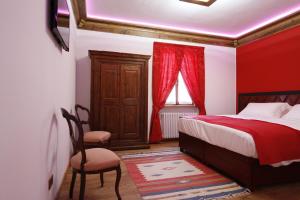 Postel nebo postele na pokoji v ubytování B&B alla Piazzetta
