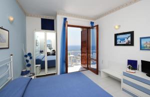 a bedroom with a bed and a balcony at Casa Jole in Amalfi