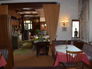 a living room with a table and a dining room at Hotel-Restaurant Ochsen in Haslach im Kinzigtal