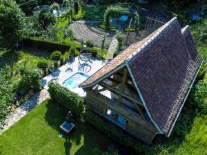 an overhead view of a house with a swimming pool at Le B Cottage & SPA Privé in Riquewihr