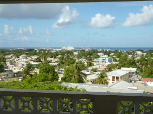 a view of a city from a balcony at A Home Away from Home in Saint Michael