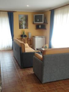 TV a/nebo společenská místnost v ubytování Casa Os Batans