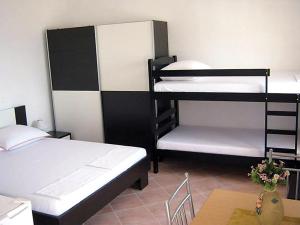 Кровать или кровати в номере Apartments Denis