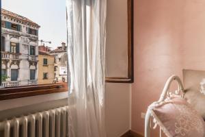 A bed or beds in a room at CASA DELL'ARTISTA