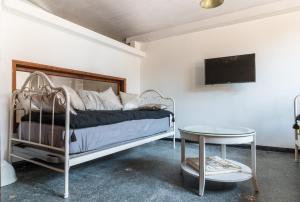 A bed or beds in a room at CASA DELL'ARTISTA
