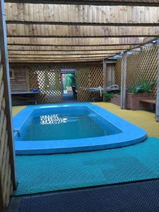 a swimming pool in the middle of a house at M10 Service in Posenichi