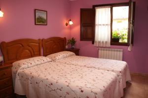 En eller flere senge i et værelse på La Pontiga de Avalle
