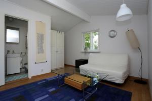 a bedroom with a bed and a table in a room at Villa near Åhus in Yngsjö