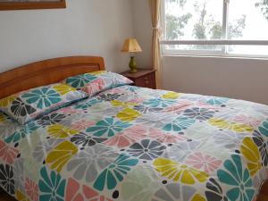 Кровать или кровати в номере Condominio Bahia Pelicanos - Horcon