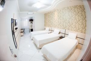 TV a/nebo společenská místnost v ubytování Hotel Tito's