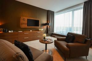 TV a/nebo společenská místnost v ubytování Grid Hotel