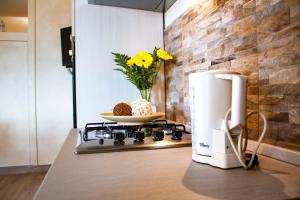 a coffeemaker sitting on top of a stove in a kitchen at Taormina Family Apartment in Taormina