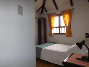 Ένα ή περισσότερα κρεβάτια σε δωμάτιο στο La Casona Nuñez