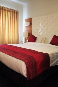 Postel nebo postele na pokoji v ubytování Hotel Ivory 32