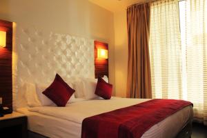 Postel nebo postele na pokoji v ubytování Hotel Ivory 32