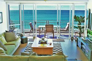 a living room with a view of the ocean at Indigo Blue in Gold Coast