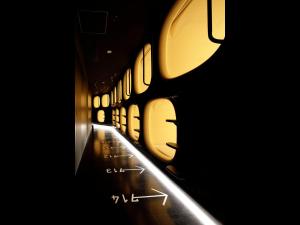 a hallway of a train with a line of windows at 9h nine hours woman Kanda in Tokyo