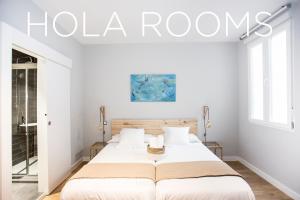 Ένα ή περισσότερα κρεβάτια σε δωμάτιο στο Hola Rooms