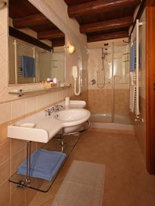 a bathroom with a sink and a shower at Chalet Chez Nous in Sauze dʼOulx