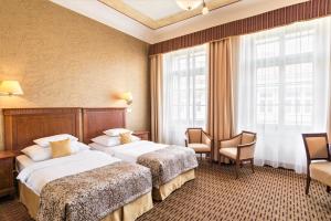 Postel nebo postele na pokoji v ubytování Majestic Plaza Hotel Prague