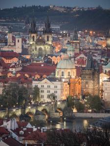a city with buildings and a clock tower at Pension Karlova in Prague