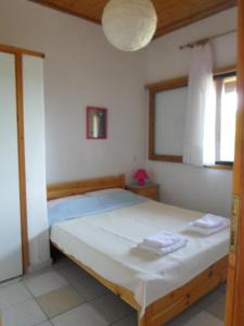 Postel nebo postele na pokoji v ubytování Bozelia Apartments